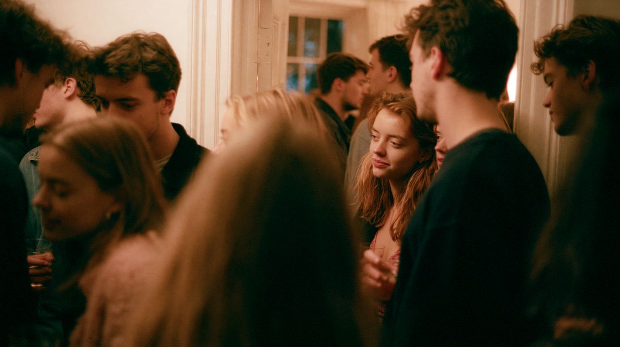 A crowded party with people packed close together.